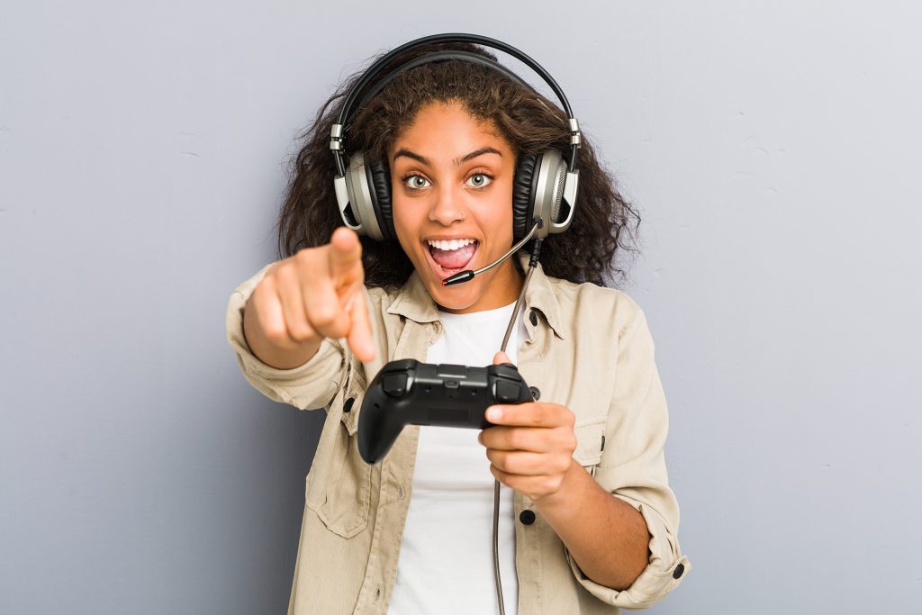 Young african american woman using headphones and game controlle LEAP Challenge image